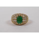 An 18ct yellow gold dress ring, set with diamonds and an emerald, approx 3cts, size K/L