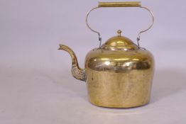 A large Victorian brass kettle, 42cm high