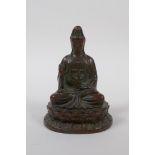 A Chinese bronze of Quan Yin seated on a lotus flower throne, 10cm high
