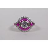 An Art Deco style silver dress ring set with cubic zirconia and rubies, size O