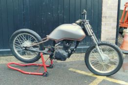 A part converted motorcycle with Honda engine and parts