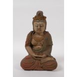 A Chinese carved and painted wood figure of Quan Yin, 23cm high