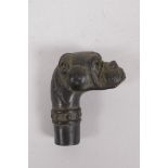 A bronze walking stick handle in the form of a dog's head, 7cm