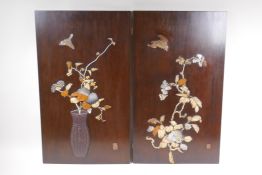 Two Japanese hardwood panels, inset with mother of pearl and carved bone decoration, both signed,