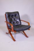 A mid century bentwood and button leather easy chair