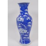 A Chinese KangXi pottery blue and white vase decorated with prunus blossom on a cracked ice