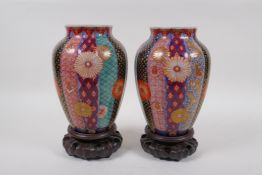 A pair of Japanese Meiji period ovoid Imari porcelain vases by Fukagawa Koransha, with ribbed body