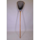 An antique bamboo and cherry fish landing net, 220cm long