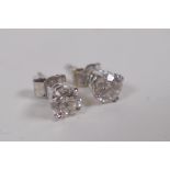 A pair of 18ct white gold diamond stud earrings, approx 1ct total
