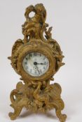 A French ormolu mantel clock, the case decorated with playing cherubs, the time piece movement