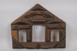 A C19th Tramp art frame with four apertures, largest 10cm x 14cm