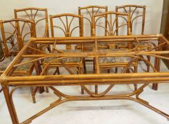 A bamboo cane conservatory suite of four + two chairs, and table en suite, lacks glass top, 150 x