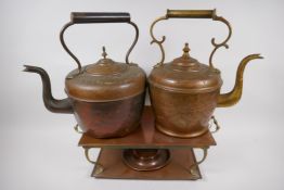 A vintage brass and copper warming stand, 42cm wide, and two C19th copper and brass kettles