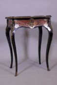 A C19th French serpentine shaped boulework work table, with gilt tooled inset leather top opening to