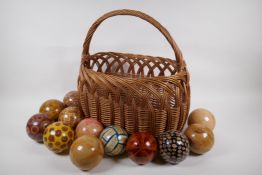A collection of vintage decorative specimen balls, containing seed pods, nuts, star fish etc, in a