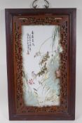 A Chinese Republic period porcelain panel decoration with birds amongst lotus flowers, in a carved