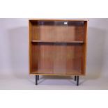 A mid century Robin Day for hille, mahogany bookcase with sliding doors, 92cm x 30cm x 109cm