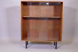 A mid century Robin Day for hille, mahogany bookcase with sliding doors, 92cm x 30cm x 109cm