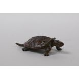 A Japanese bronze okimono turtle, impressed mark to base, 6cm long