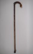 A C19th bamboo walking stick with hallmarked silver mount (Birmingham, 1899) and concealed brass