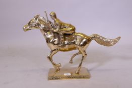 A brass figure of a racehorse and jockey, 39cm high