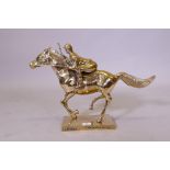 A brass figure of a racehorse and jockey, 39cm high