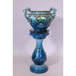 A George Jones & Sons majolica 'orient ware' two handled jardiniere on stand, in vibrant blue glaze,