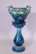 A George Jones & Sons majolica 'orient ware' two handled jardiniere on stand, in vibrant blue glaze,