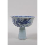 A Chinese blue and white porcelain stem cup with dragon decoration and ribbed stem, 9cm high x