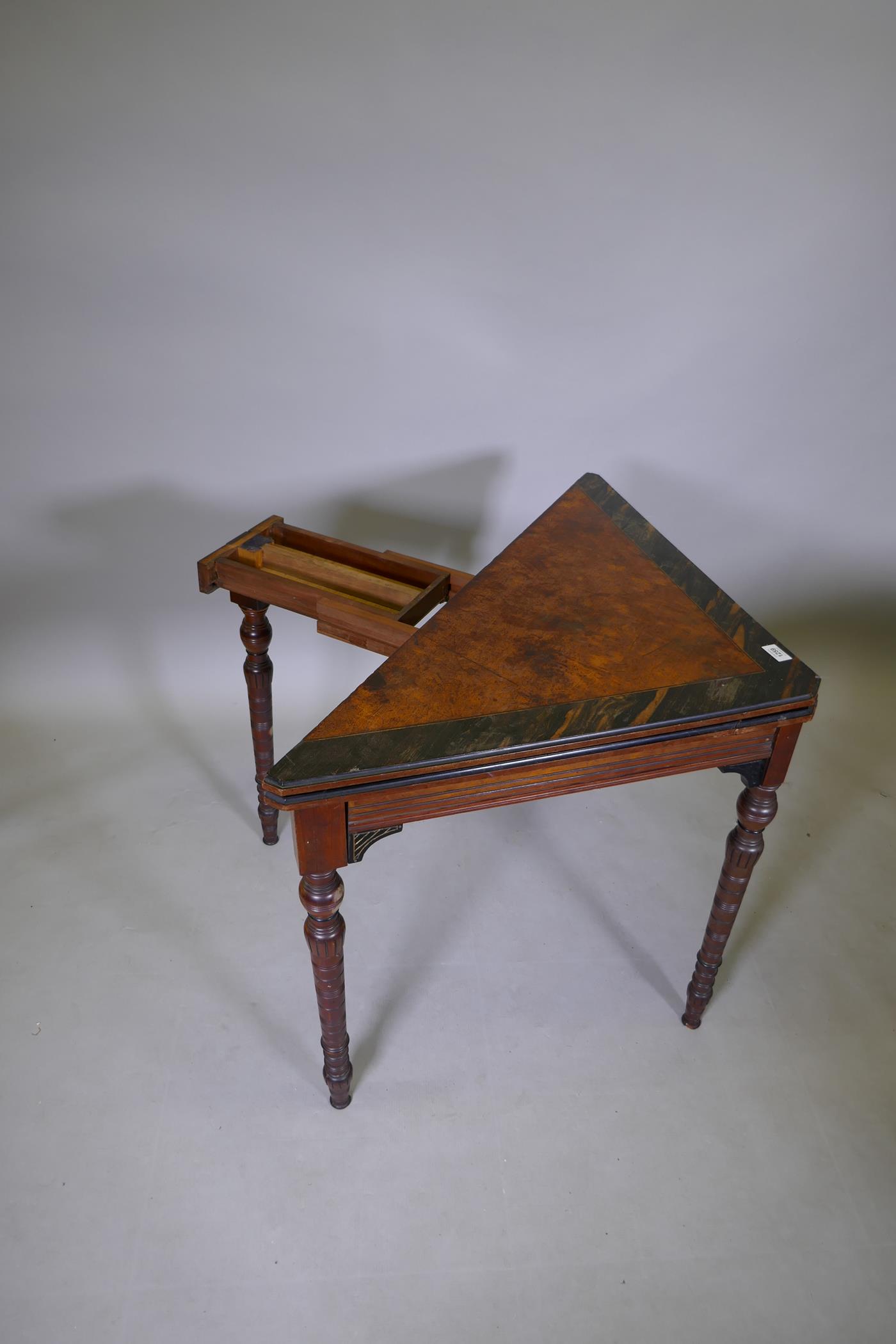 An Arts & Crafts satinwood and coromandel games table with fold over top and turned supports, 75 x - Image 3 of 7