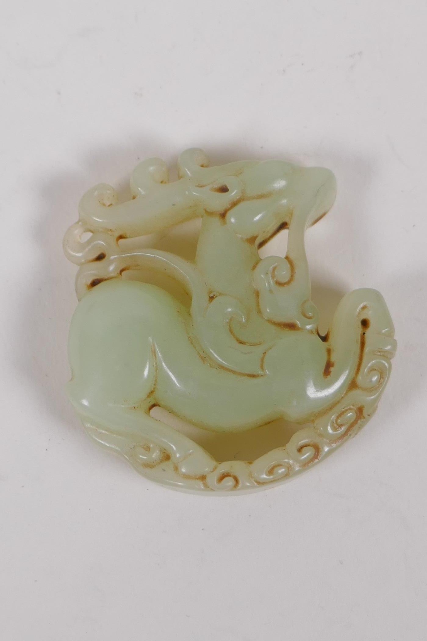 A Chinese carved celadon jade deer pendant, 5cm diameter - Image 2 of 2
