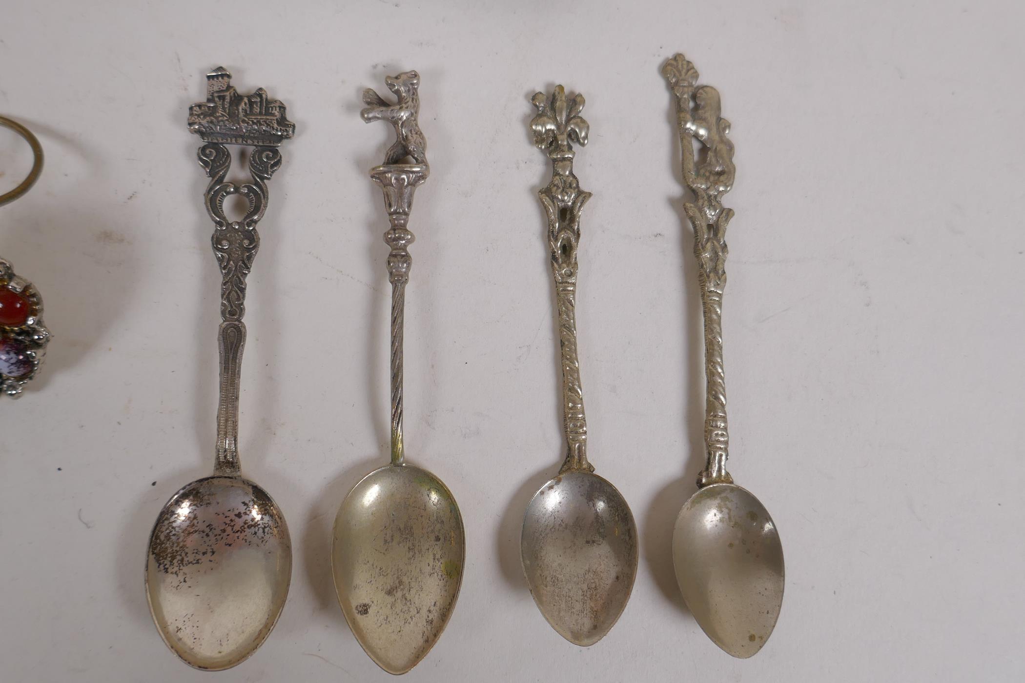 A collection of silver, silver plate and white metal items to include tea spoons, coin spoons, - Image 8 of 9