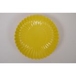 A yellow ground porcelain petal shaped dish, Chinese Yongzheng seal mark to base, 19cm diameter