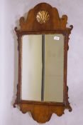 A C19th walnut and parcel gilt fretwork wall mirror with carved shell cartouche, 96cm x 48cm