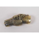 A brass vesta case in the form of a horse's head, 6cm long