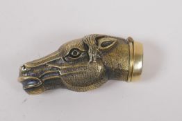 A brass vesta case in the form of a horse's head, 6cm long