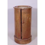A C19th mahogany cylinder shaped pot cupboard with inset marble top, 70cm x 38cm