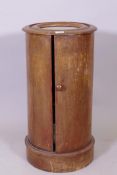 A C19th mahogany cylinder shaped pot cupboard with inset marble top, 70cm x 38cm