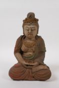 A Chinese carved and painted wood figure of Quan Yin, 23cm high