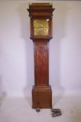 An C18th oak longcase clock with brass dial and chapter ring, eight day movement striking on a