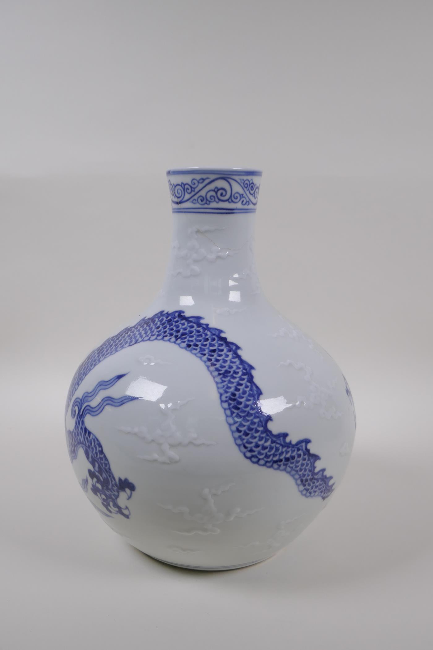 A blue and white porcelain vase decorated with a dragon in flight, Chinese Xuande 6 character mark - Image 4 of 9