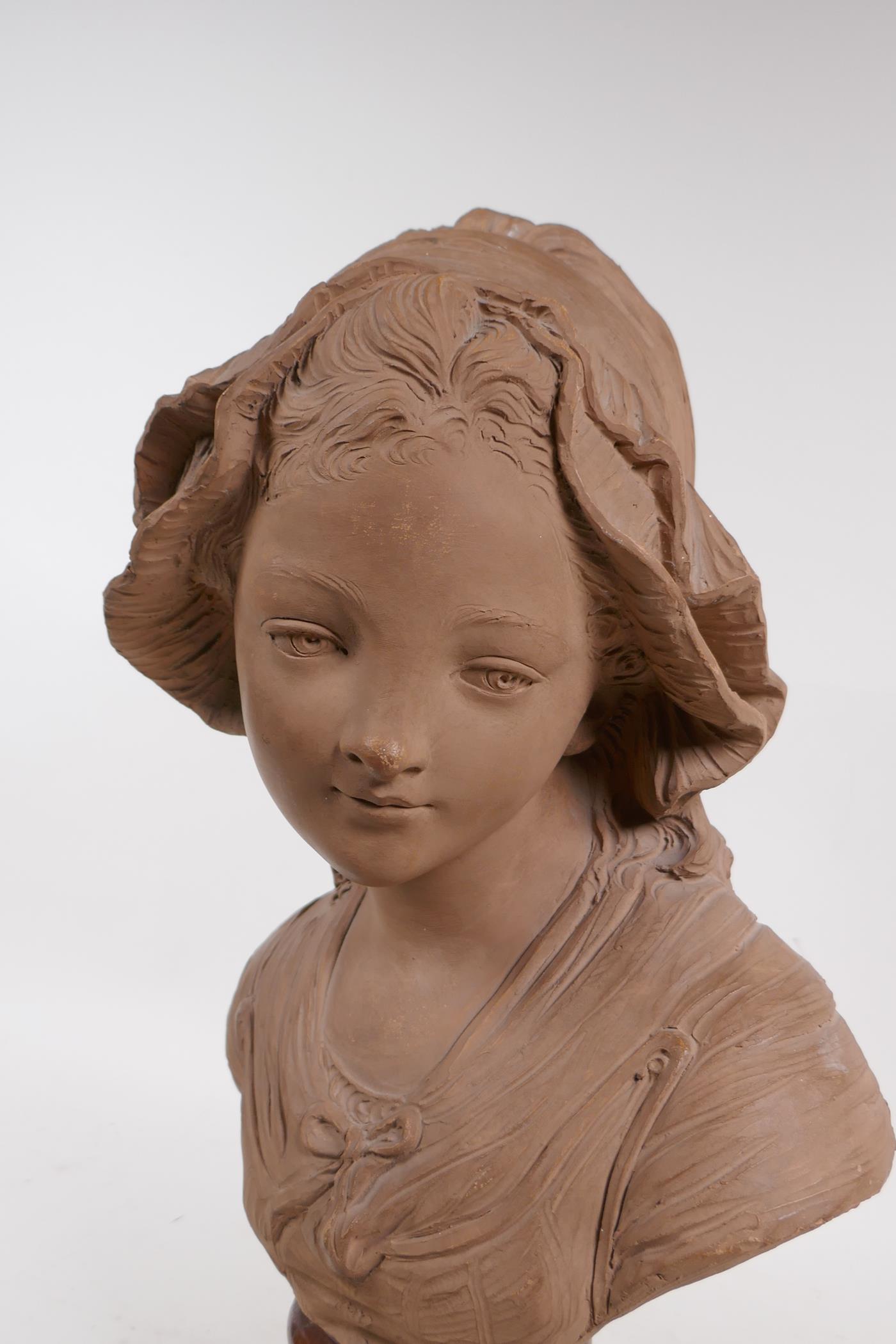 A C19th terracotta bust of a young girl in a bonnet, mounted on a marble socle, 46cm high - Image 4 of 4