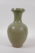 A Chinese olive green glazed porcelain vase with underglaze scrolling floral decoration, 23cm high