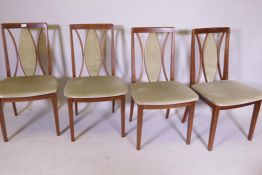 A set of four G-Plan mahogany dining chairs with pierced elipse backs
