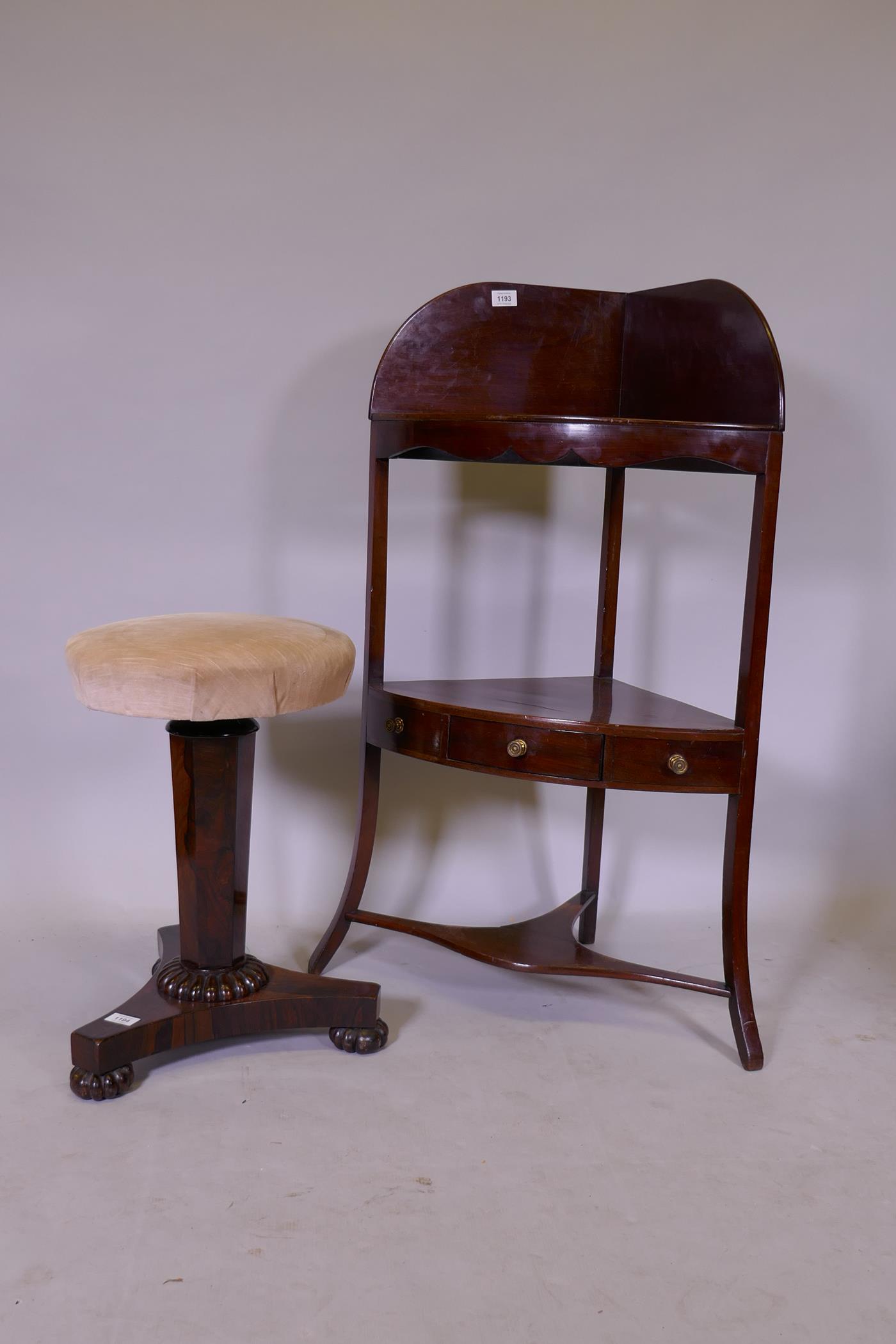 A Victorian mahogany corner washstand with single drawer and splashback raised on sabre supports,
