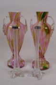 A pair of slender clear glass specimen vases with hallmarked silver rims, 21cm high, and a pair of