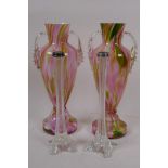 A pair of slender clear glass specimen vases with hallmarked silver rims, 21cm high, and a pair of