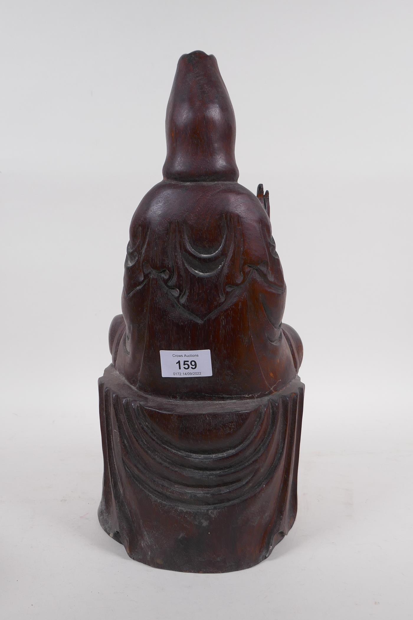 A hardwood carving of Quan Yin, seated upon a lotus throne, 40cm high - Image 4 of 4