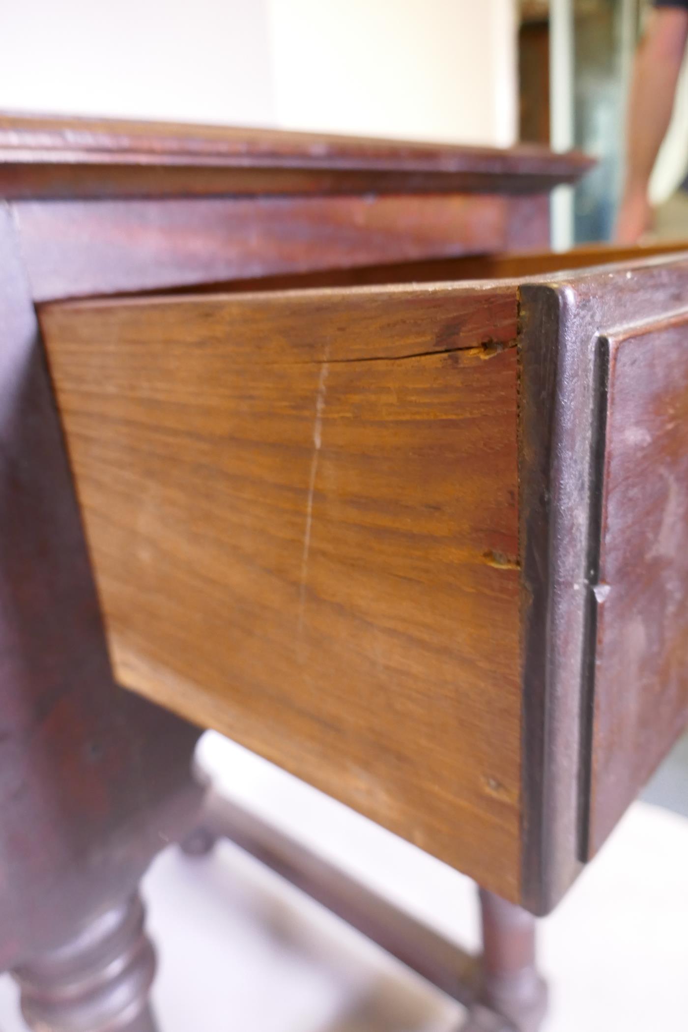 A South African hardwood Georgian style dresser base, with three drawers and shaped apron, raised on - Image 5 of 5