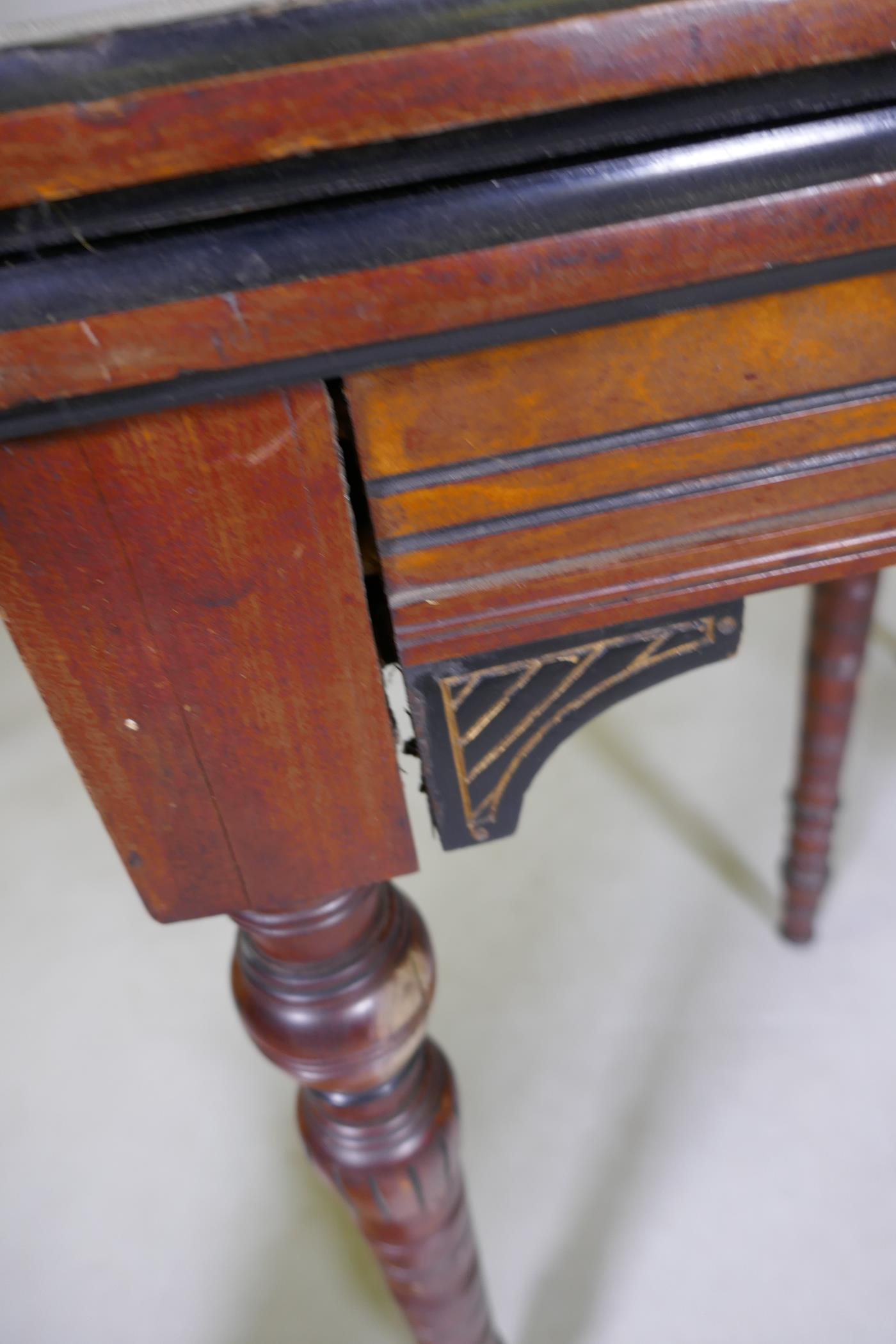 An Arts & Crafts satinwood and coromandel games table with fold over top and turned supports, 75 x - Image 6 of 7